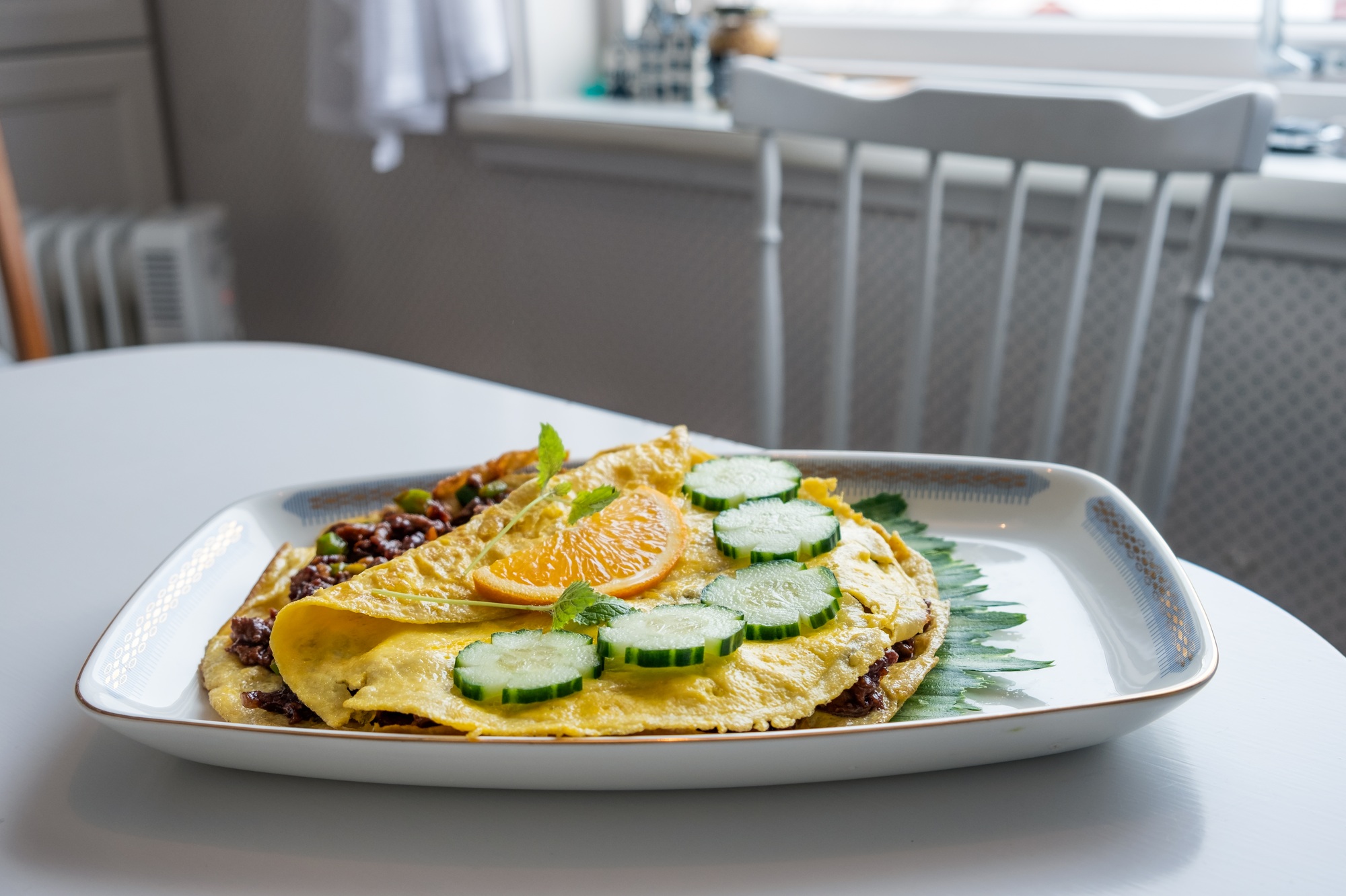 Food recipe of Omelet fried with pork chops on table